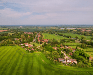 Aerial view of a rural village in England representing communities outside mayoral areas